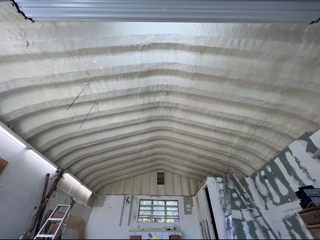 Spray polyurethane foam applied to the underside of a metal roof deck in Robertsdale
